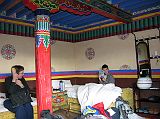 14 Charlotte Ryan And Peter Ryan In Tingri Everest Snow Leopard Hotel Room In 2005 Charlotte Ryan and Peter Ryan relax in the Everest Snow Leopard Hotel in Tingri in 2005. It has clean unheated rooms and a shared, very clean squat toilet. It also has solar-heated showers.